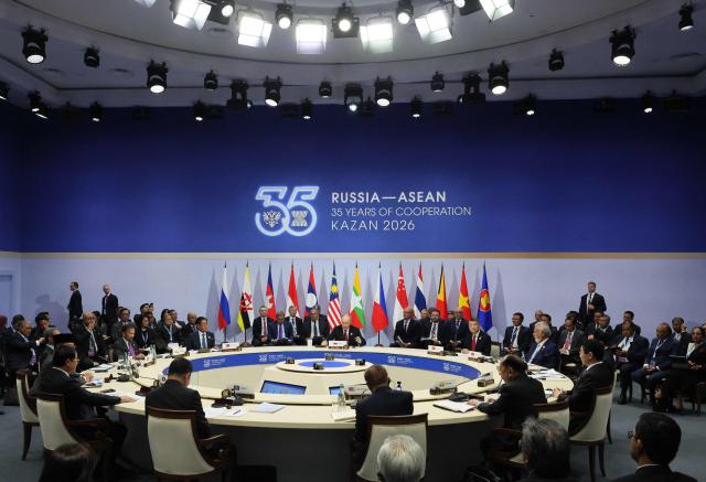 Russian President Vladimir Putin and the heads of delegations attend a plenary session of the Russia-ASEAN summit, which commemorates 35 years of collaboration between Russia and the ASEAN countries, in the central Russian city of Kazan, around 700 kilometres (435 miles) east of the capital Moscow, on June 18, 2026. (Photo by Anastasia Barashkova / POOL / AFP)