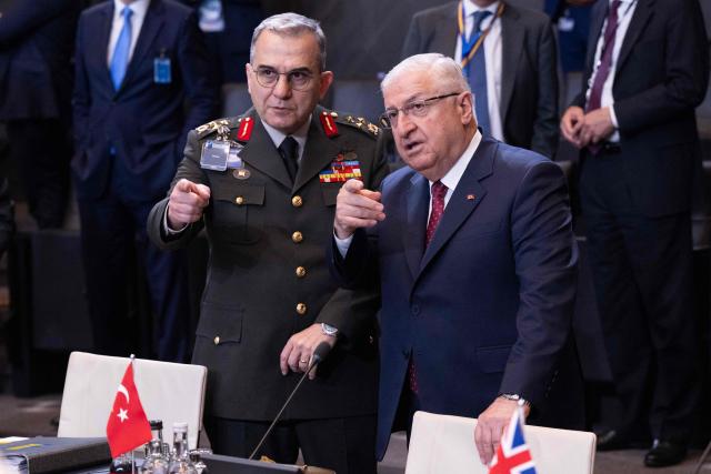 Turkey's Defence Minister Yasar Guler (R) attends a NATO Defence Ministers meeting at the NATO headquarters, in Brussels, on June 18, 2026. (Photo by JOHN THYS / AFP)