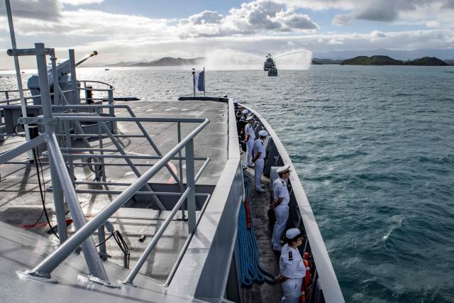 Naval officers stand aboard the Entrecasteux ship as part of the naval welcome parade for the French Overseas Patrol Vessel Jean Tranape navigating off the coast of Noumea in the French overseas collectivity of New Caledonia, on June 18, 2026. The Patrol Vessel Jean Tranape has joined the armed forces in New Caledonia at its new home port in Noumea. (Photo by Delphine MAYEUR / AFP)