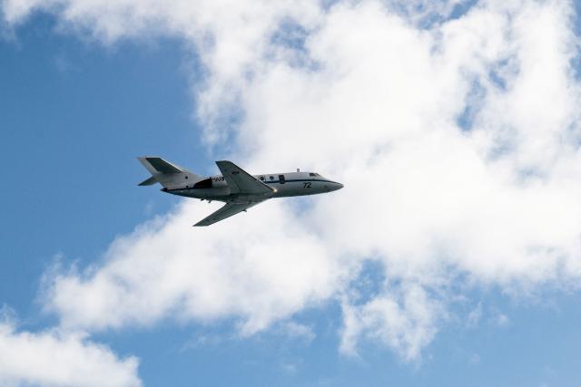 A photograph taken on June 18, 2026 shows the flypast by the maritime patrol aircraft as part of the welcome ceremony for the French Overseas Patrol Vessel Jean Tranape navigating off the coast of Noumea in the French overseas collectivity of New Caledonia. The Patrol Vessel Jean Tranape has joined the armed forces in New Caledonia at its new home port in Noumea. (Photo by Delphine MAYEUR / AFP)