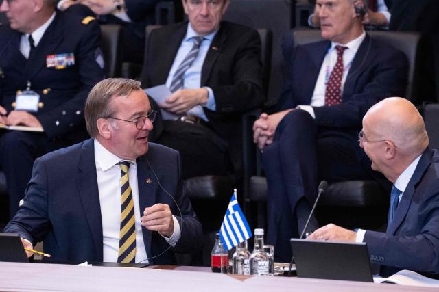 Germany's Defence Minister Boris Pistorius (L) speaks with Greece's Defence Minister Nikolaos Dendias before the start of a NATO Defence Ministers meeting at the NATO headquarters, in Brussels, on June 18, 2026. (Photo by JOHN THYS / AFP)
