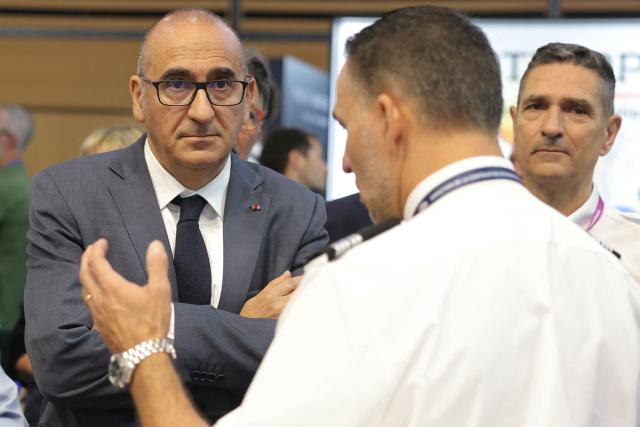 France's Interior Minister Laurent Nunez (L) reacts as he visits Eurosatory, a land and airland defence and security trade fair in Villepinte on the outskirts of Paris, on June 18, 2026. (Photo by Thomas SAMSON / AFP)
