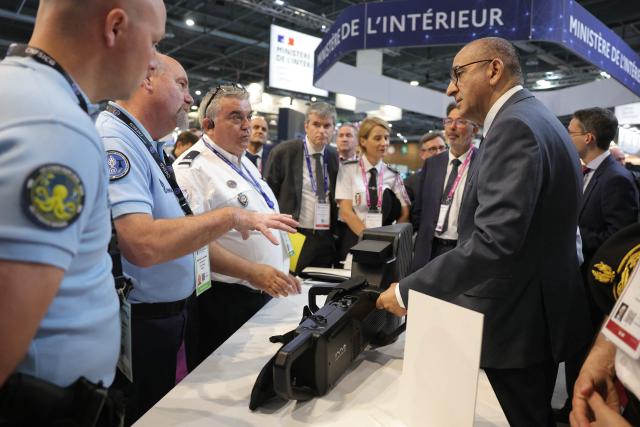 France's Interior Minister Laurent Nunez (R) reacts as he is presented a Sniper DP anti-drone jammer at the Interior Ministry's stand of Eurosatory, a land and airland defence and security trade fair in Villepinte on the outskirts of Paris, on June 18, 2026. (Photo by Thomas SAMSON / AFP)