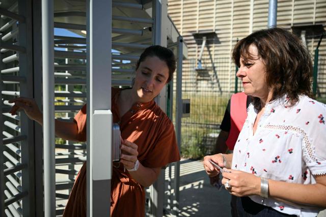 French trade union General Confederation of Labour (CGT) secretary general Sophie Binet  (L) and  President of the Occitanie region Carole Delga (R) arrive at the Paper pulp producer Fibre Excellence factory site in Saint-Gaudens, south western France, on June 18, 2026 during a rally organised by employees as the company faces the withdrawal of its shareholder from Indonesia, Jackson Widjaja. The Fibre Excellence group, which employs 670 people, 275 in Saint-Gaudens and 270 in Tarascon, produces 500,000 tonnes annually out of the two million tonnes of paper pulp consumed in France. (Photo by Lionel BONAVENTURE / AFP)