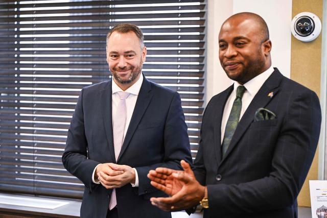 Belgium's Deputy Prime Minister and Minister of Foreign Affairs Maxime Prevot (L) attends the sale of traceable artisanally mined diamonds from DR Congo at the Antwerp World Diamond Centre (AWDC) in Antwerp on June 18, 2026. The diamonds originate from the Kasai region and were mined as part of OrigemA, a Belgian-Congolese initiative that guarantees a fully transparent chain. (Photo by Tom Goyvaerts / Belga / AFP) / Belgium OUT