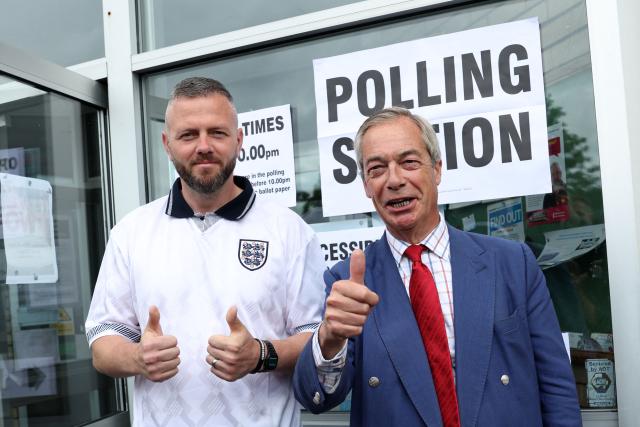 Reform UK's candidate Rob Kenyon and Reform UK Leader Nigel Farage pose for a photo as Kenyon arrives to cast his vote in the the Makerfield by-election, at a polling station in Winstanley, part of the Makerfield parliamentary constituency, in north-west England on June 18, 2026. Britain holds a unique vote on June 18 that could trigger the endgame for Labour leader Keir Starmer's beleaguered premiership, or win him a reprieve. (Photo by Darren Staples / AFP)