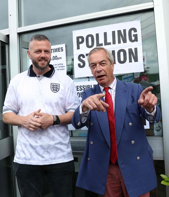 Reform UK's candidate Rob Kenyon and Reform UK Leader Nigel Farage pose for a photo as Kenyon arrives to cast his vote in the the Makerfield by-election, at a polling station in Winstanley, part of the Makerfield parliamentary constituency, in north-west England on June 18, 2026. Britain holds a unique vote on June 18 that could trigger the endgame for Labour leader Keir Starmer's beleaguered premiership, or win him a reprieve. (Photo by Darren Staples / AFP)