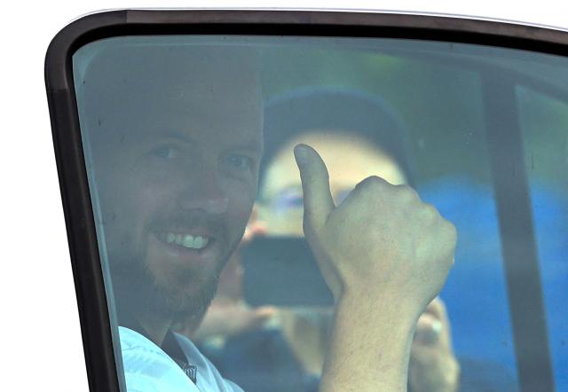 Reform UK's candidate Rob Kenyon gives a thumbs up as he drives away in his van with Reform UK Leader Nigel Farage, after voting in the the Makerfield by-election, at a polling station in Winstanley, part of the Makerfield parliamentary constituency, in north-west England on June 18, 2026. Britain holds a unique vote on June 18 that could trigger the endgame for Labour leader Keir Starmer's beleaguered premiership, or win him a reprieve. (Photo by Darren Staples / AFP)
