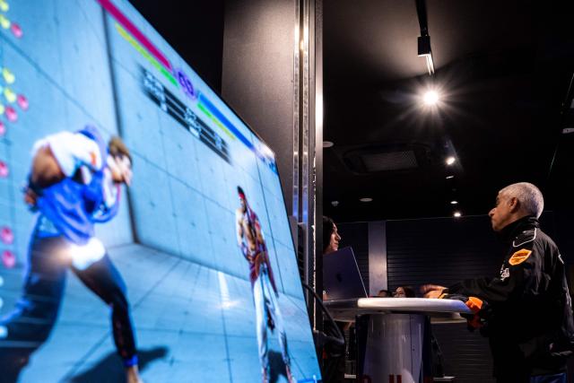 London's Mayor Sadiq Khan (R) visits the Red Bull Gaming Sphere Tokyo in the city's Nakano district on June 18, 2026. (Photo by Philip FONG / AFP)
