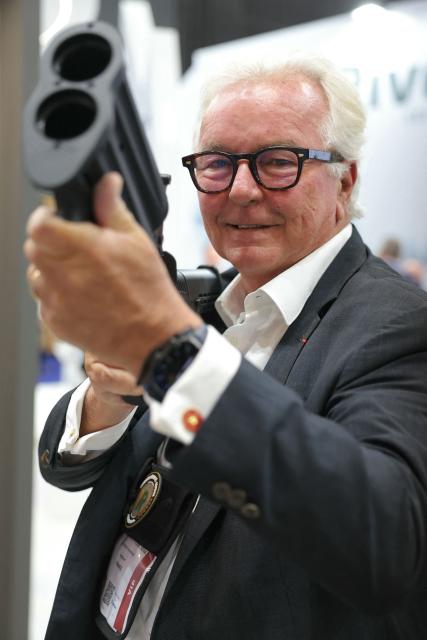 President of Rivolier Arnaud Van Robais poses with a rubber bullet launcher at Eurosatory defence and security trade fair in Villepinte on the outskirts of Paris, on June 18, 2026. (Photo by Thomas SAMSON / AFP)
