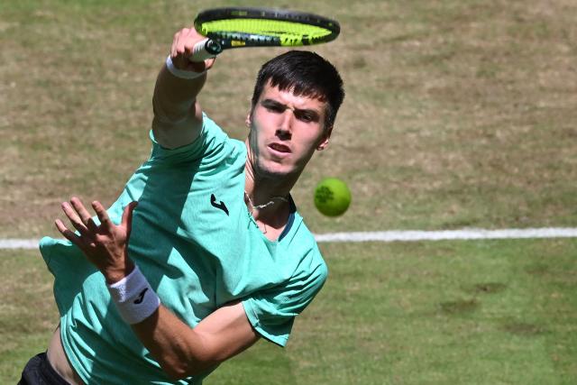 Hungary's Fabian Marozsan returns the ball to US' Taylor Fritz during their men's singles round of 16 tennis match of the Halle Open ATP tennis tournament in Halle, western Germany, on June 18, 2026. (Photo by CARMEN JASPERSEN / AFP)