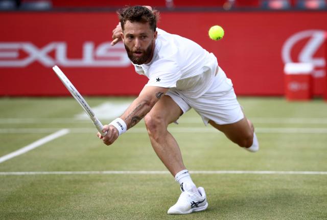 France's Corentin Moutet returns against Spain's Alejandro Davidovich Fokina during their men's singles round of 16 tennis match on day three of the ATP HSBC Championships at Queen's Club in west London on June 18, 2026. (Photo by Henry NICHOLLS / AFP)