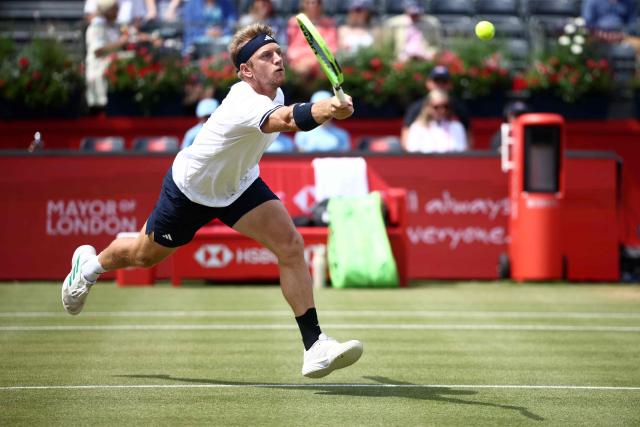 Spain's Alejandro Davidovich Fokina returns against France's Corentin Moutet during their men's singles round of 16 tennis match on day three of the ATP HSBC Championships at Queen's Club in west London on June 18, 2026. (Photo by Henry NICHOLLS / AFP)