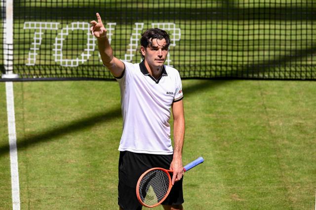 US' Taylor Fritz reacts while playing Hungary's Fabian Marozsan during their men's singles round of 16 tennis match of the Halle Open ATP tennis tournament in Halle, western Germany, on June 18, 2026. (Photo by CARMEN JASPERSEN / AFP)