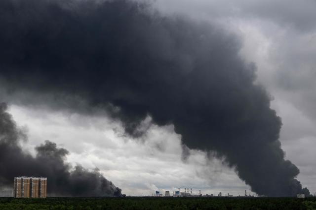 Black smoke rises from the area of the Russian oil producer Gazprom Neft's Moscow oil refinery on the south-eastern outskirts of Moscow on June 18, 2026. Moscow was fending off a "large-scale" drone attack from Ukraine, with several drones reaching an oil refinery, the city's mayor Sergey Sobyanin said early on June 18, 2026. (Photo by AFP)