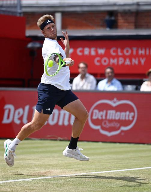 Spain's Alejandro Davidovich Fokina returns against France's Corentin Moutet during their men's singles round of 16 tennis match on day three of the ATP HSBC Championships at Queen's Club in west London on June 18, 2026. (Photo by Henry NICHOLLS / AFP)