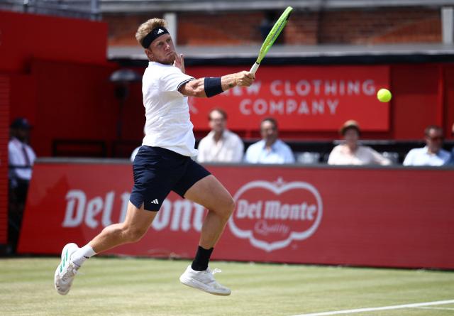 Spain's Alejandro Davidovich Fokina returns against France's Corentin Moutet during their men's singles round of 16 tennis match on day three of the ATP HSBC Championships at Queen's Club in west London on June 18, 2026. (Photo by Henry NICHOLLS / AFP)