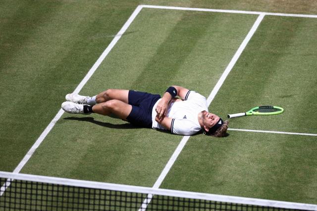 Spain's Alejandro Davidovich Fokina reacts after diving to play a return against France's Corentin Moutet during their men's singles round of 16 tennis match on day three of the ATP HSBC Championships at Queen's Club in west London on June 18, 2026. (Photo by Henry Nicholls / AFP)