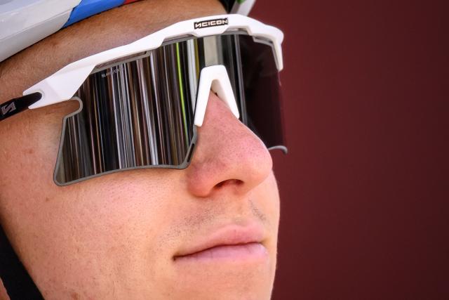UAE Team Emirates XRG’s Slovenian rider Tadej Pogacar looks on during the team presentation of the second stage of the Men’s Tour of Switzerland (Tour de Suisse) cycling race in Locarno, Switzerland, on June 18, 2026. (Photo by Fabrice COFFRINI / AFP)