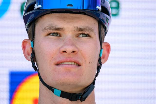 XDS-Astana Team's Kazakh rider Nicolya Vinokurov looks on during the team presentation of the second stage of the Men’s Tour of Switzerland (Tour de Suisse) cycling race in Locarno, Switzerland, on June 18, 2026. (Photo by Fabrice COFFRINI / AFP)