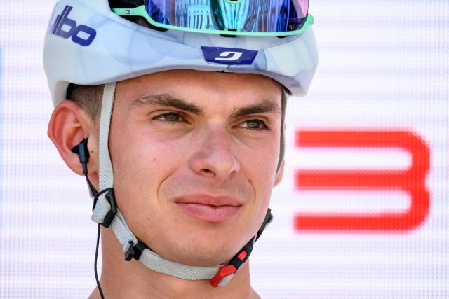 Groupama-FDJ's French rider Romain Gregoire looks on during the team presentation of the second stage of the Men’s Tour of Switzerland (Tour de Suisse) cycling race in Locarno, Switzerland, on June 18, 2026. (Photo by Fabrice COFFRINI / AFP)