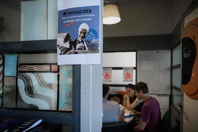 Journalists from Mediacite media and volunteers examine the expense reports of French MP Laurent Wauquiez when he was president of The Auvergne Rhone-Alpes region at the Mediacite office in Lyon, central France on June 18, 2026, After five years of legal battles, the independent media outlet succeeded in securing the local authority’s disclosure of the invoices and expense claims submitted by members of the executive and their staff between 2019 and 2021. (Photo by Jeff PACHOUD / AFP)