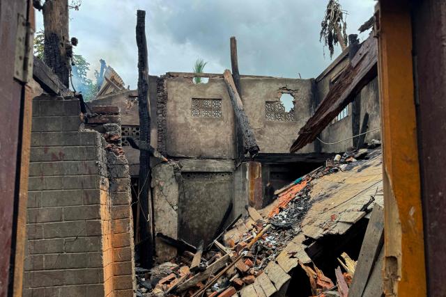 A general view shows the ruins of a building after an airstrike by Myanmar's military in Kyauktaw, western Rakhine State on June 18, 2026. A Myanmar military airstrike has killed seven civilians including a five-year-old child in the country's conflict-ravaged west, a witness and a rescue worker said on June 18. (Photo by AFP)