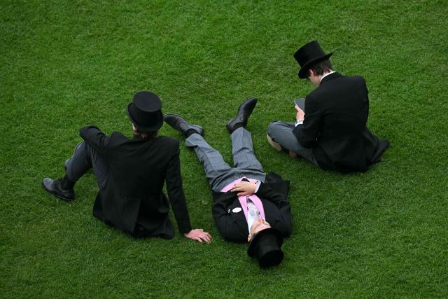 Racegoers attend the third day of the Royal Ascot horse racing meeting in Ascot, west of London, on June 18, 2026. (Photo by JUSTIN TALLIS / AFP)