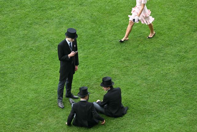 Racegoers attend the third day of the Royal Ascot horse racing meeting in Ascot, west of London, on June 18, 2026. (Photo by JUSTIN TALLIS / AFP)