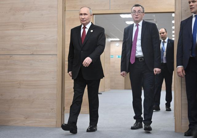 Russia's President Vladimir Putin arrives for a meeting with Thailand's Prime Minister on the sidelines of the Russia-ASEAN summit, which commemorates 35 years of collaboration between Russia and the ASEAN countries, in the central Russian city of Kazan, around 700 kilometres (435 miles) east of the capital Moscow, on June 18, 2026. (Photo by Alexander NEMENOV / POOL / AFP)