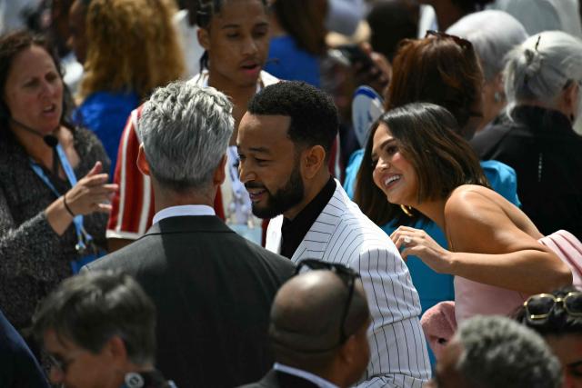 US singer-songwriter John Legend and his wife US model Chrissy Teigen arrive at the opening of the Barack Obama Presidential Center in Chicago, Illinois, on June 18, 2026. (Photo by Kent NISHIMURA / AFP)