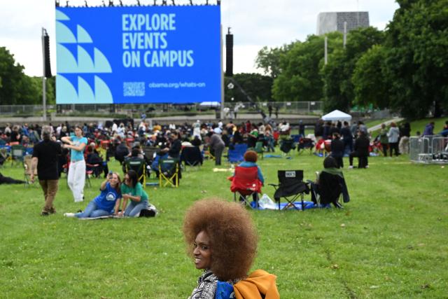 People attend a watch party for the opening of the Barack Obama Presidential Center along the Midway Plaisance in Chicago, Illinois, on June 18, 2026. (Photo by Alex WROBLEWSKI / AFP)