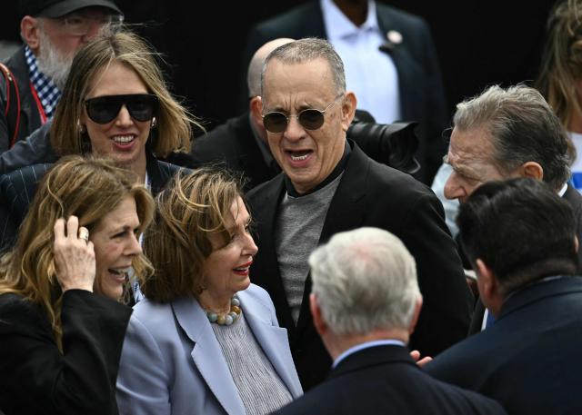 (L/R) US actress Rita Wilson, US Representative Nancy Pelosi, and US actor Tom Hanks arrive at the opening of the Barack Obama Presidential Center in Chicago, Illinois, on June 18, 2026. (Photo by Kent NISHIMURA / AFP)