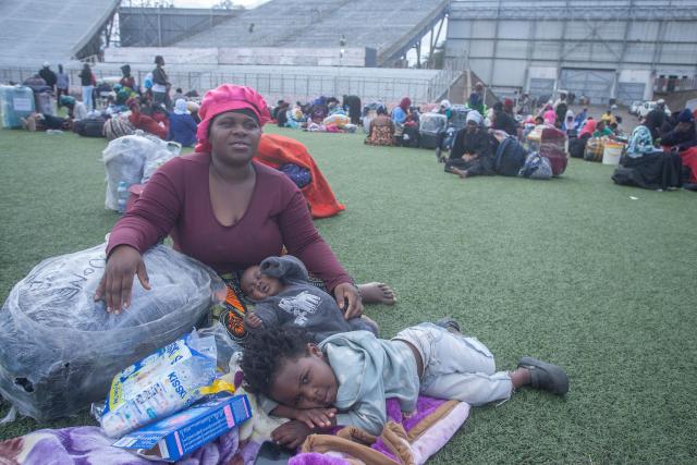 Malawians repatriated from South Africa arrive at Kamuzu stadium, the countrys receiving camp on June 18, 2026 before being identified and transported to their districts. Thousands of Malawians have crammed into a field in the South African city of Durban in dire conditions, desperate to return home and escape a wave of violence against foreigners.
Frustration and anger are building at the makeshift camp at Sherwood Park, where some have been waiting for days for buses to take them back to Malawi, more than 2,000 kilometres (1,300 miles) away. (Photo by Amos GUMULIRA / AFP)