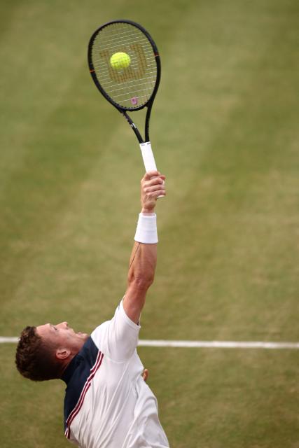 Czech Republic's Jiri Lehecka serves against Australia's Rinky Hijikata during their men's singles round of 16 tennis match on day three of the ATP HSBC Championships at Queen's Club in west London on June 18, 2026. (Photo by Henry Nicholls / AFP)