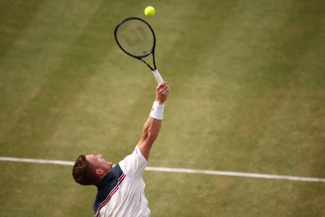 Czech Republic's Jiri Lehecka serves against Australia's Rinky Hijikata during their men's singles round of 16 tennis match on day three of the ATP HSBC Championships at Queen's Club in west London on June 18, 2026. (Photo by Henry Nicholls / AFP)