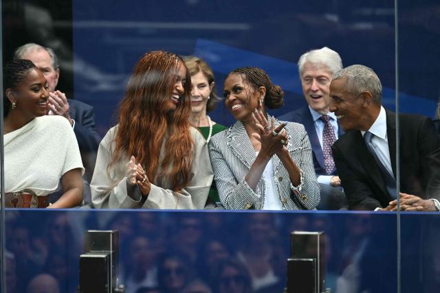 Former US president Barack Obama (R), his wife Michelle Obama (2R), and his daughters, Malia (L) and Sasha Obama, attend the opening of the Barack Obama Presidential Center in Chicago, Illinois, on June 18, 2026. (Photo by Kent NISHIMURA / AFP)