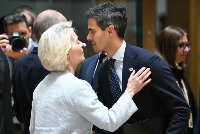 European Commission President Ursula von der Leyen greets Netherlands'  Prime Minister Rob Jetten at a round table meeting during the EU Summit at the EU headquarters in Brussels, on June 18, 2026. (Photo by NICOLAS TUCAT / AFP)
