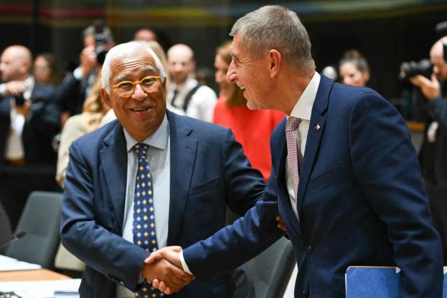 Czech Republic's Prime Minister Andrej Babis (R) shakes hands with President of the European Council Antonio Costa at a round table meeting during the EU Summit at the EU headquarters in Brussels, on June 18, 2026. (Photo by NICOLAS TUCAT / AFP)