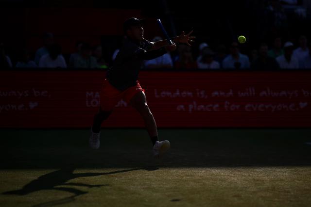 Australia's Rinky Hijikata returns against Czech Republic's Jiri Lehecka during their men's singles round of 16 tennis match on day three of the ATP HSBC Championships at Queen's Club in west London on June 18, 2026. (Photo by Henry NICHOLLS / AFP)