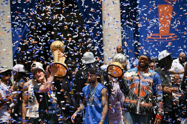 Members of the New York Knicks attend a championship celebration and Key to the City ceremony at City Hall Plaza after a ticker-tape parade honoring the team's NBA Finals victory in New York City on June 18, 2026. (Photo by ANGELA WEISS / AFP)