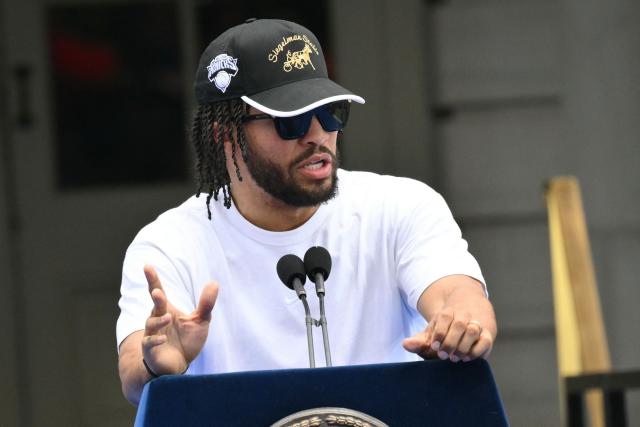 New York Knicks' #11 Jalen Brunson speaks during a championship celebration and Key to the City ceremony at City Hall Plaza after a ticker-tape parade honoring the team's NBA Finals victory in New York City on June 18, 2026. (Photo by ANGELA WEISS / AFP)