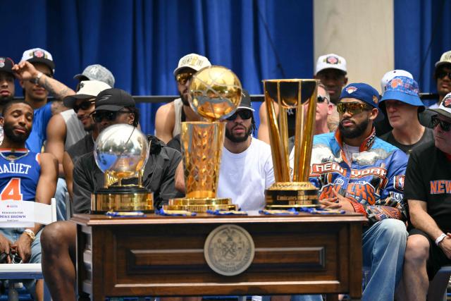 Members of the New York Knicks attend a championship celebration and Key to the City ceremony at City Hall Plaza after a ticker-tape parade honoring the team's NBA Finals victory in New York City on June 18, 2026. (Photo by ANGELA WEISS / AFP)