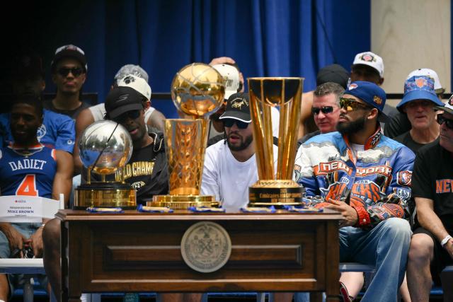 Members of the New York Knicks attend a championship celebration and Key to the City ceremony at City Hall Plaza after a ticker-tape parade honoring the team's NBA Finals victory in New York City on June 18, 2026. (Photo by ANGELA WEISS / AFP)