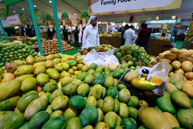 Visitors attend the 3rd edition of the Indian Mango Festival (Hamba Exhibition) at Souq Waqif in Doha on June 18, 2026. (Photo by Karim JAAFAR / AFP)