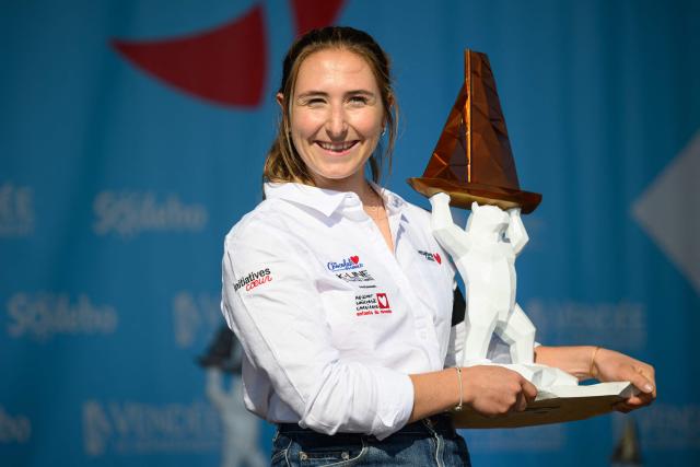 "Initiative Coeur" French skipper Violette Dorange celebrates on the podium after placing third of the Vendee Arctique solo sailing race, in Les Sables-d'Olonne on June 18, 2026. (Photo by Loic VENANCE / AFP)