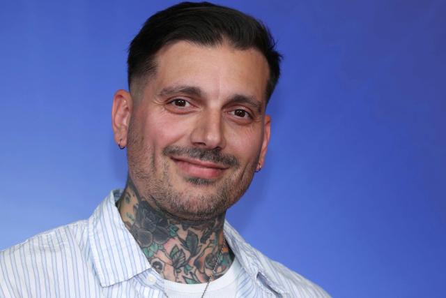 French Tattoo artist Marty Degenne poses during the TF1 Upfront 2026 photocall in Boulogne-Billancourt, West of Paris, on June 18, 2026. (Photo by Alain JOCARD / AFP)