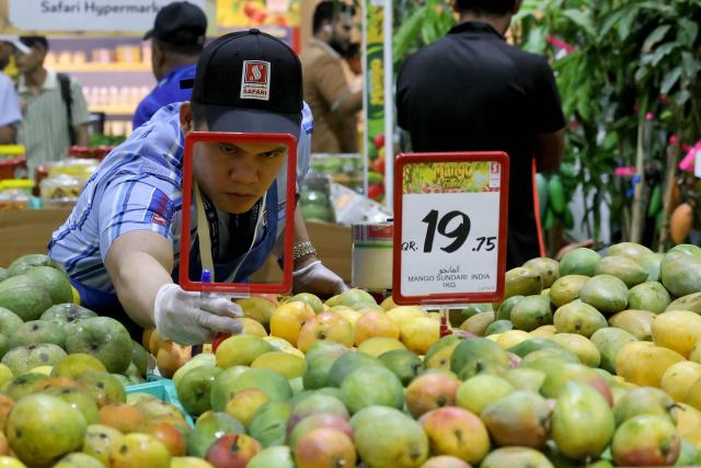 Mangoes are displayed at a stall  during the 3rd edition of the Indian Mango Festival (Hamba Exhibition) at Souq Waqif in Doha on June 18, 2026. (Photo by Karim JAAFAR / AFP)