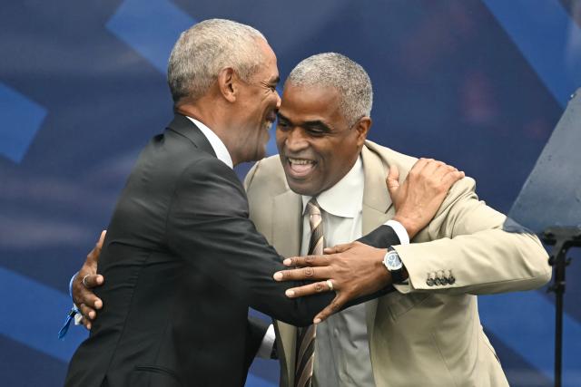 Former US president Barack Obama greets Chair of the Obama Foundation Board Marty Nesbitt (R) during opening day of the Barack Obama Presidential Center in Chicago, Illinois, on June 18, 2026. (Photo by Kent NISHIMURA / AFP)