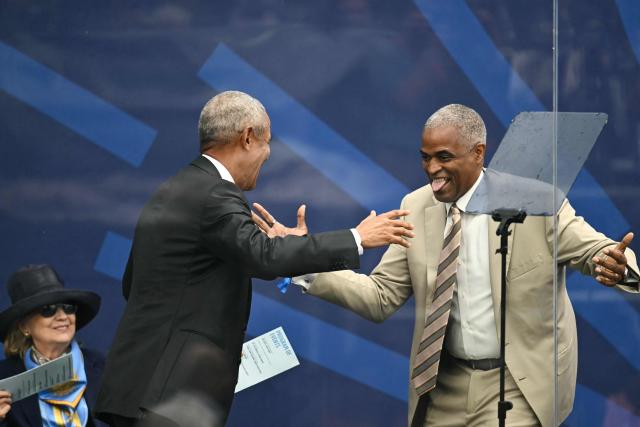 Former US president Barack Obama greets Chair of the Obama Foundation Board Marty Nesbitt (R) during opening day of the Barack Obama Presidential Center in Chicago, Illinois, on June 18, 2026. (Photo by Kent NISHIMURA / AFP)